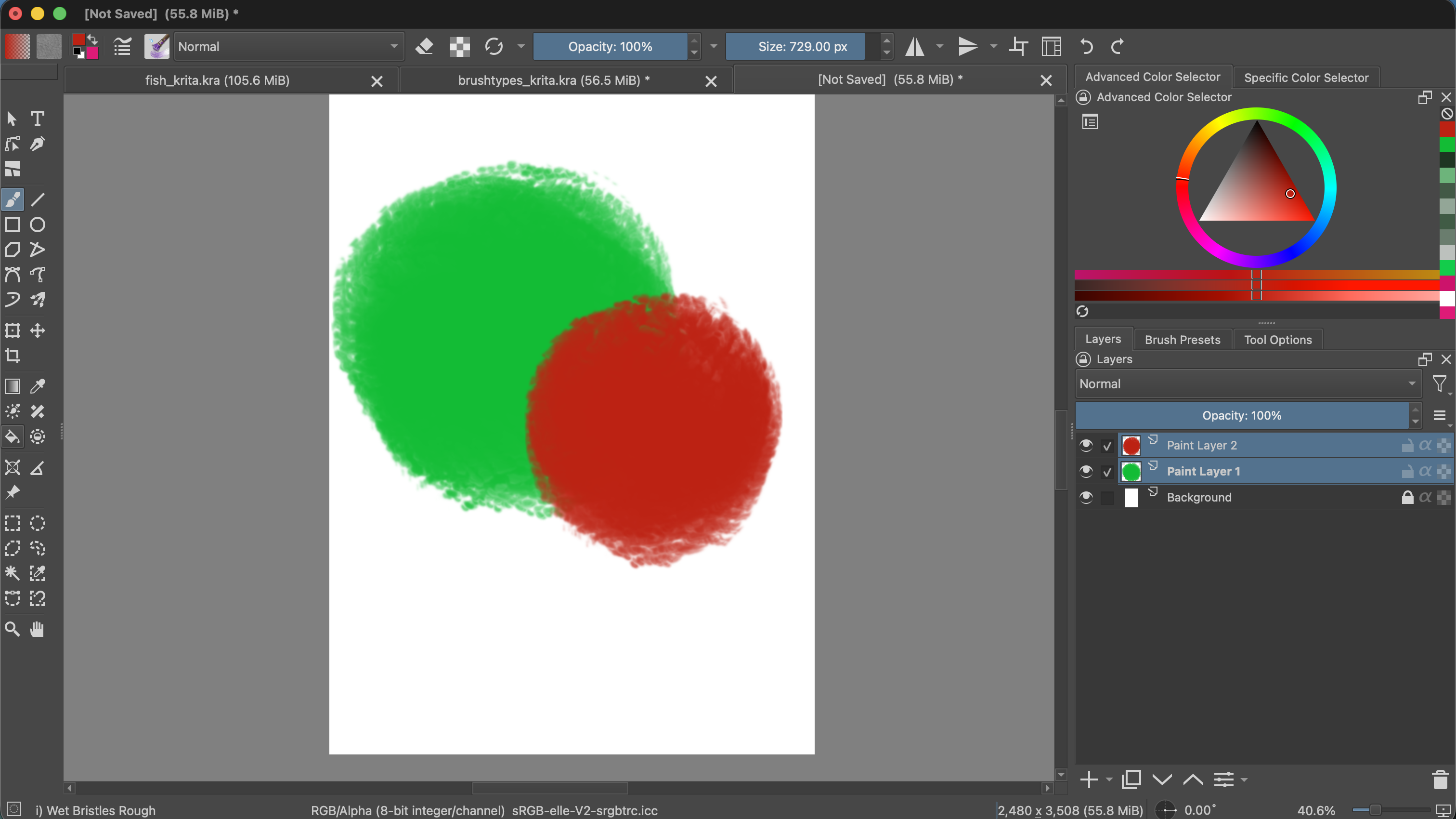 Krita canvas with a large green circle and a smaller red circle overlapping it. In the Layers docker, each circle is on a separate paint layer and they are not yet in a clipping group.